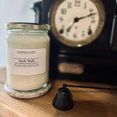 Bush Walk soy candle in glass jar with vintage clock, featuring sage, eucalyptus & lavender scents for luxury home fragrance