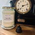Bush Walk soy candle in glass jar with vintage clock, featuring sage, eucalyptus & lavender scents for luxury home fragrance